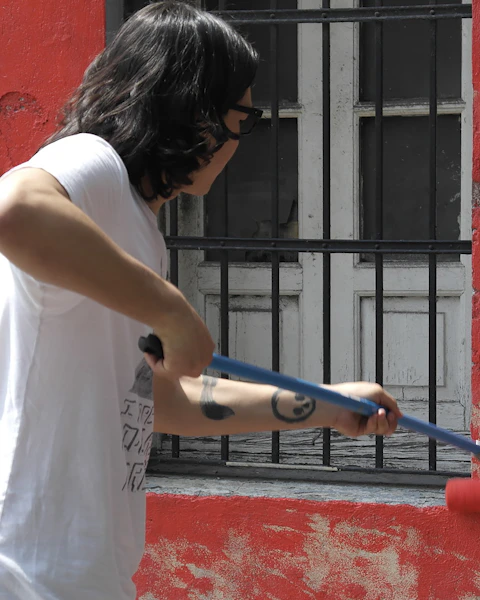 Painter rolling a wall