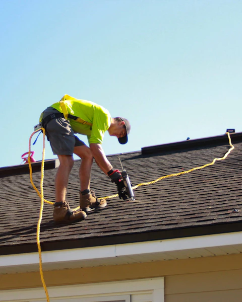 Roofer on a tiled roof